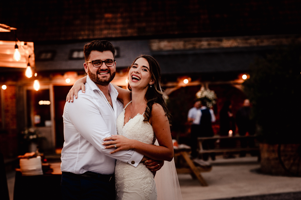 cotswolds wedding bride and groom hugginh