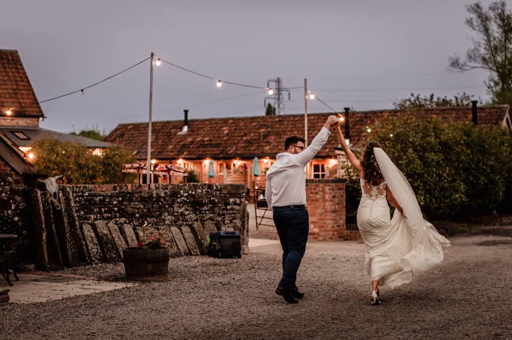 bride and groom in the countryside  milton end barn