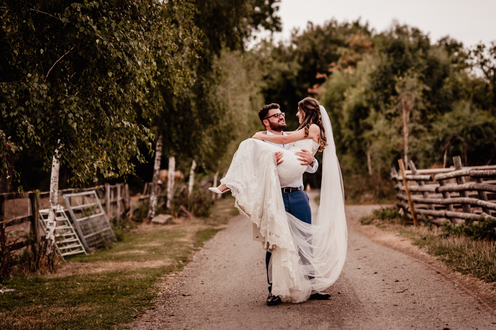 bride and groom in the countryside  milton end barn cotswolds