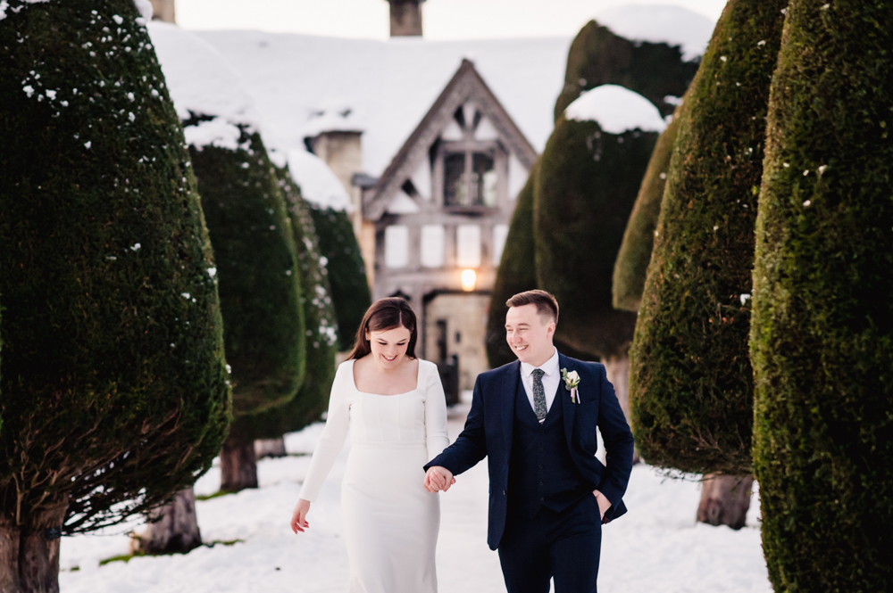 bride and groom in the snow wedding cotswolds 