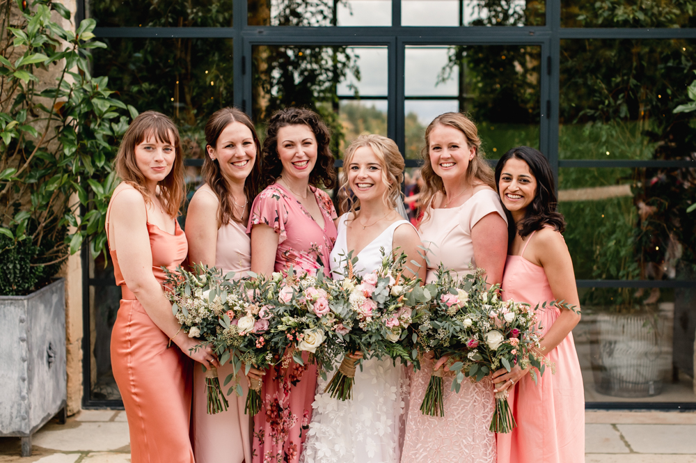 bride and bridesmaids in peach pink