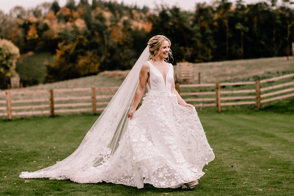bride walking savin london dress