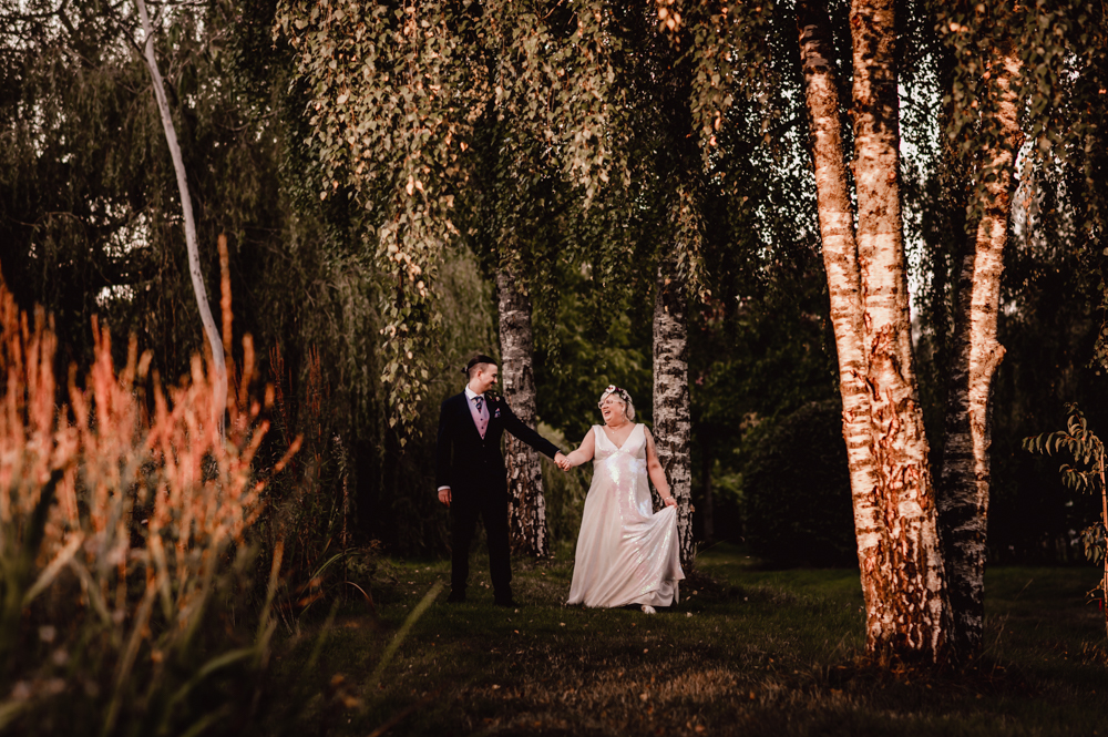 bride and groom walking dramatic wedding photography