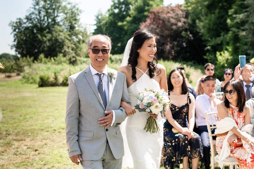 bride and dad walking down aisle