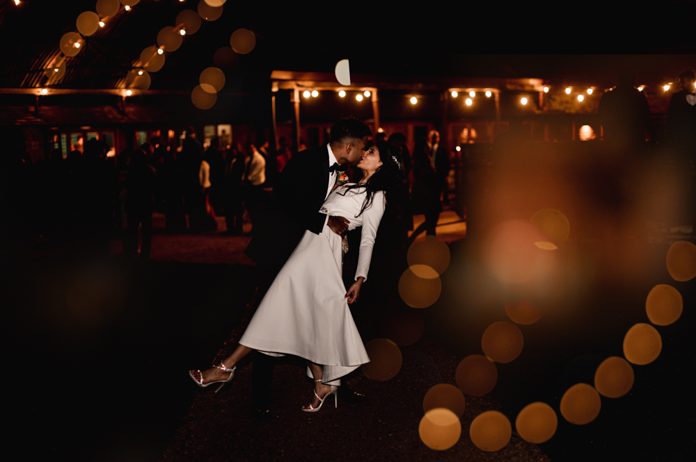 groom kissing bride Gloucestershire wedding photography