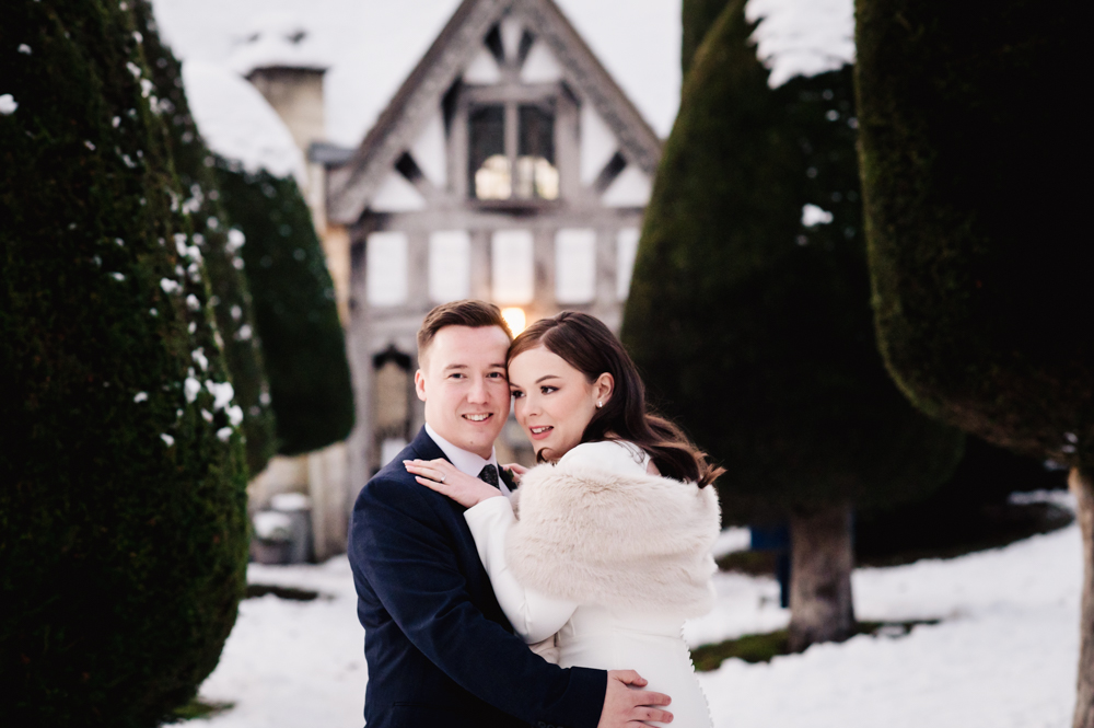 bride and groom hugging cotswolds wedding photography