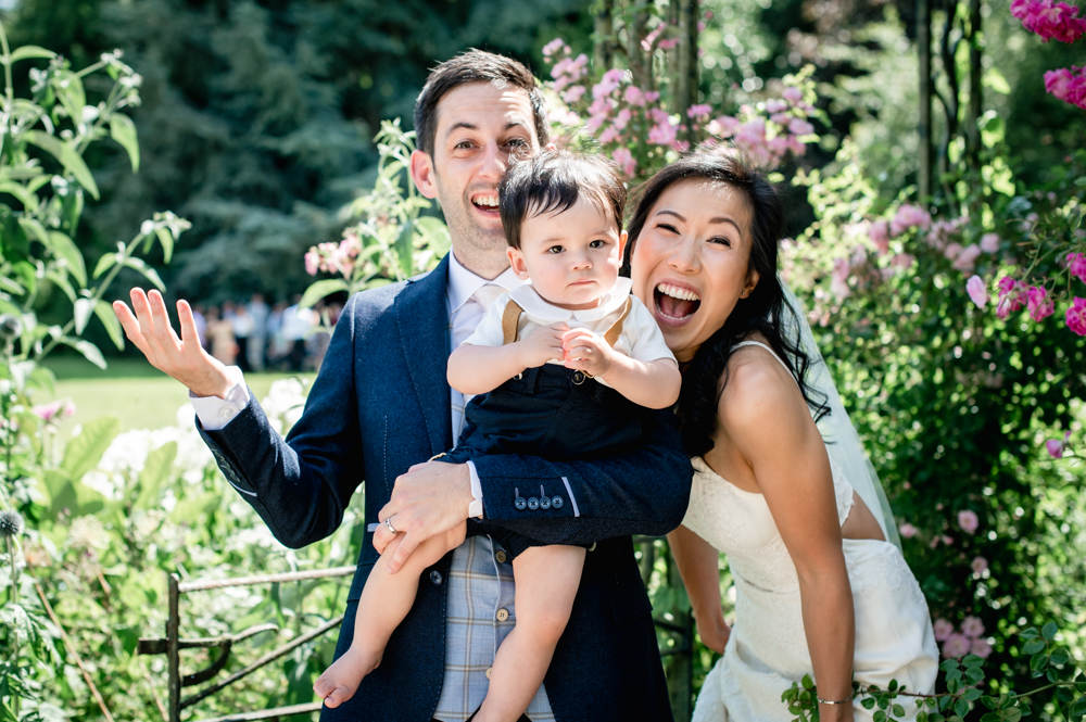 bride and groom and baby