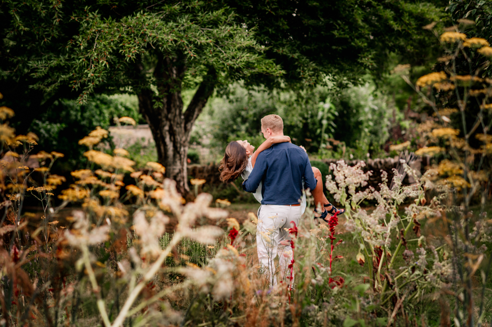 Man spinning woman countryside