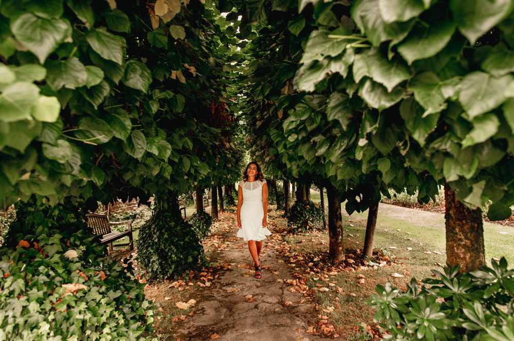 woman walking among trees barnsley house hotel cotswolds