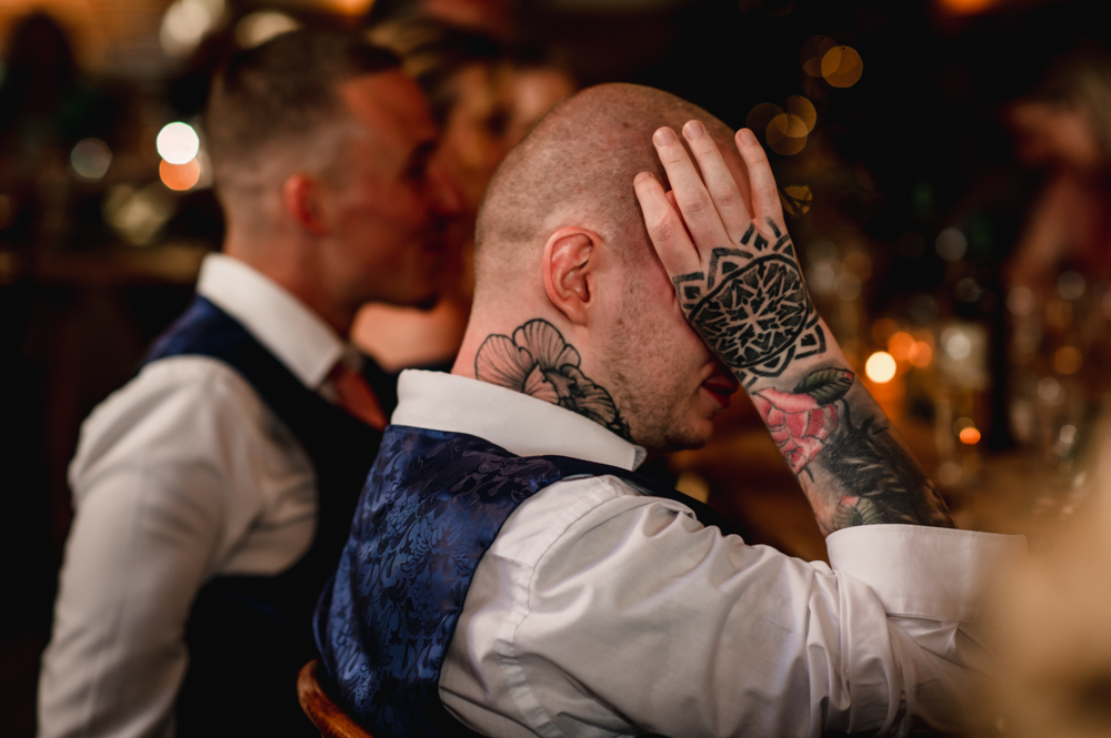 tattooed man crying wedding