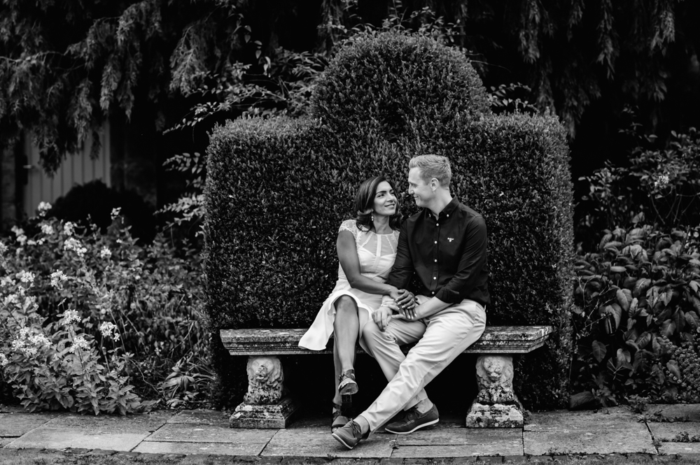 couple sitting on bench  barnsley house hotel cotswolds
