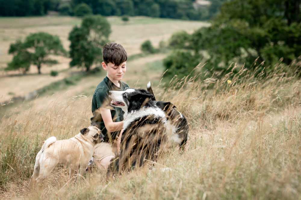 boy and dogs in the countryside natural photography