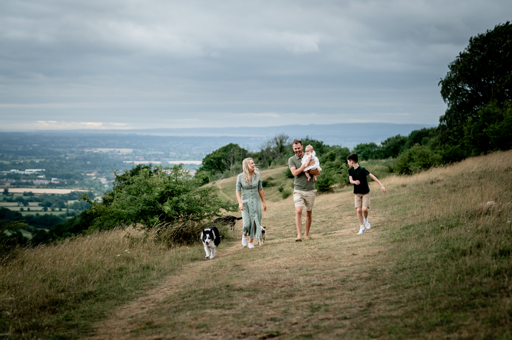 family and dogs walking in the countryside 