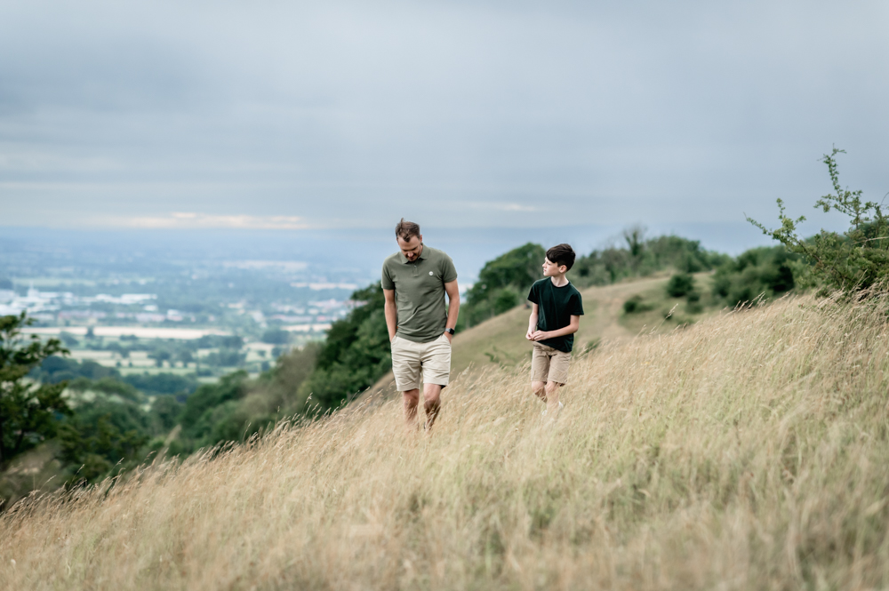 father and son walking in the countryside natural family photography