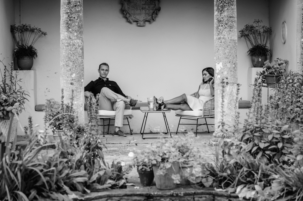 couple sitting in temple  barnsley house hotel cotswolds