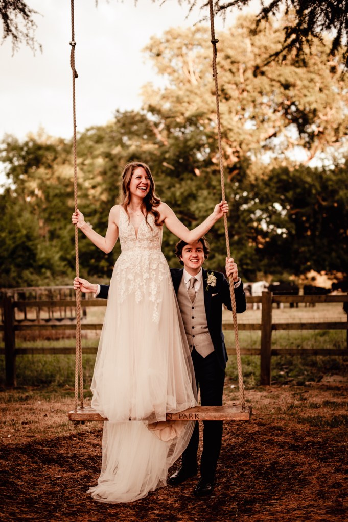 bride on swing  eastington park cotswolds