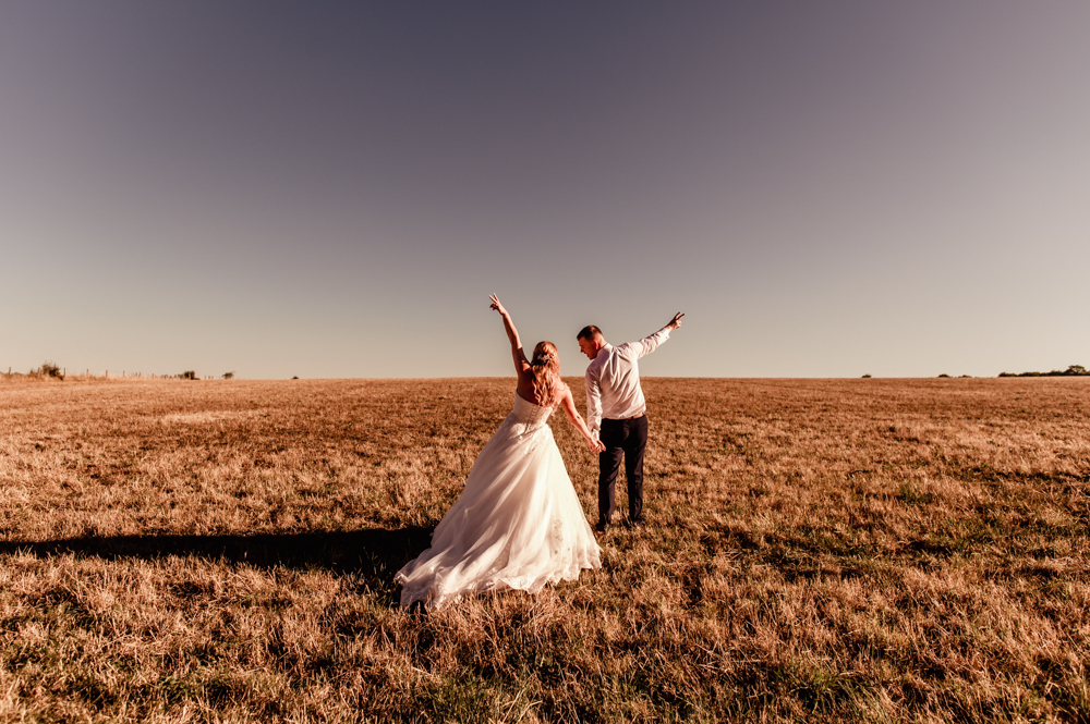 bride and groom fun wedding pose
