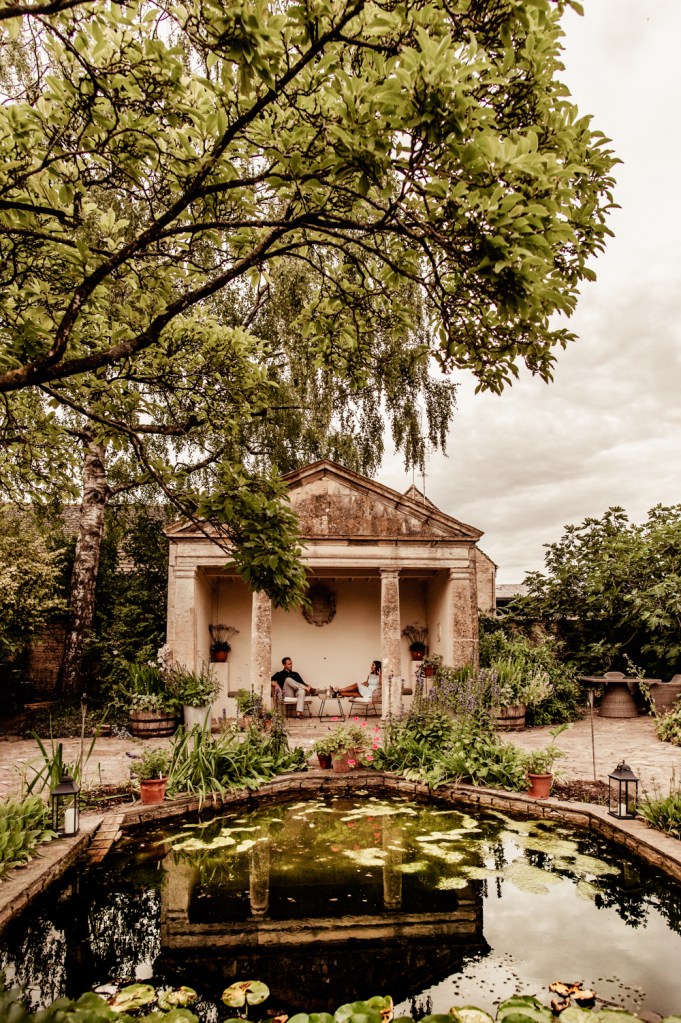 couple relaxing garden barnsley house hotel cotswolds