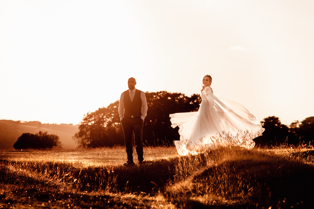 bride spinning in the countryside romantic wedding