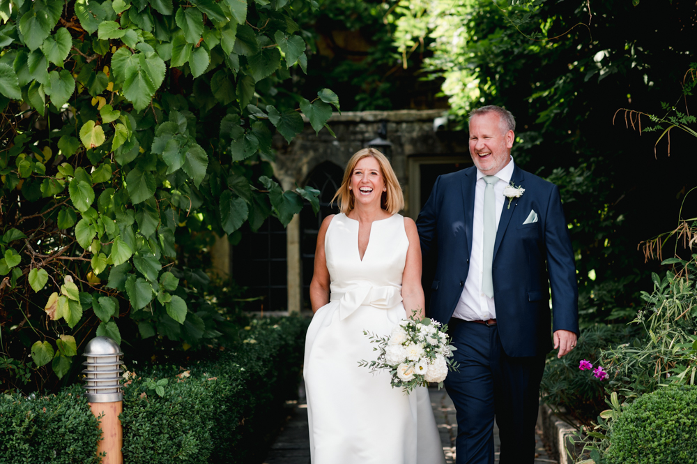 bride and groom smiling manor house hotel moreton in marsh