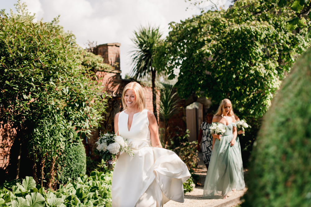 bride walking cotswolds garden
