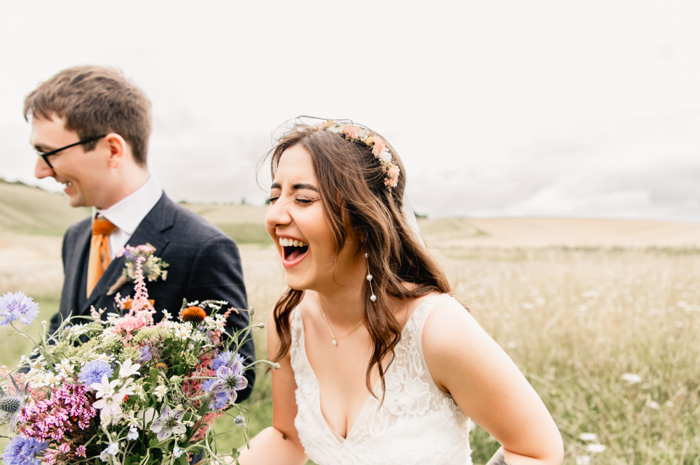 bride and groom laughing