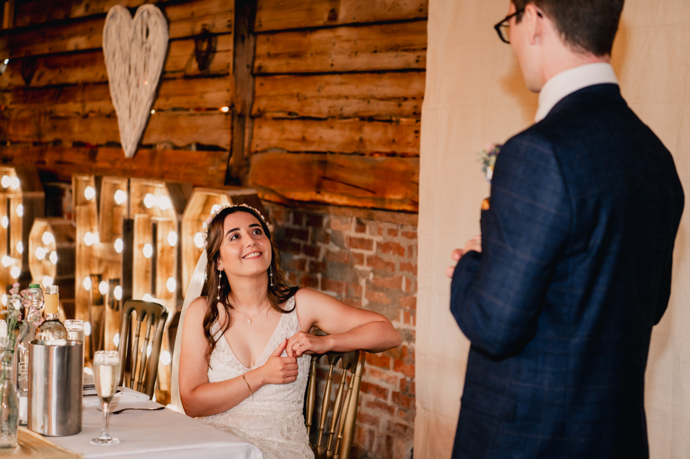 bride and groom running wellington barn wedding venue