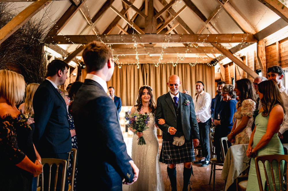 bride walking down the aisle wellington barn wiltshire.