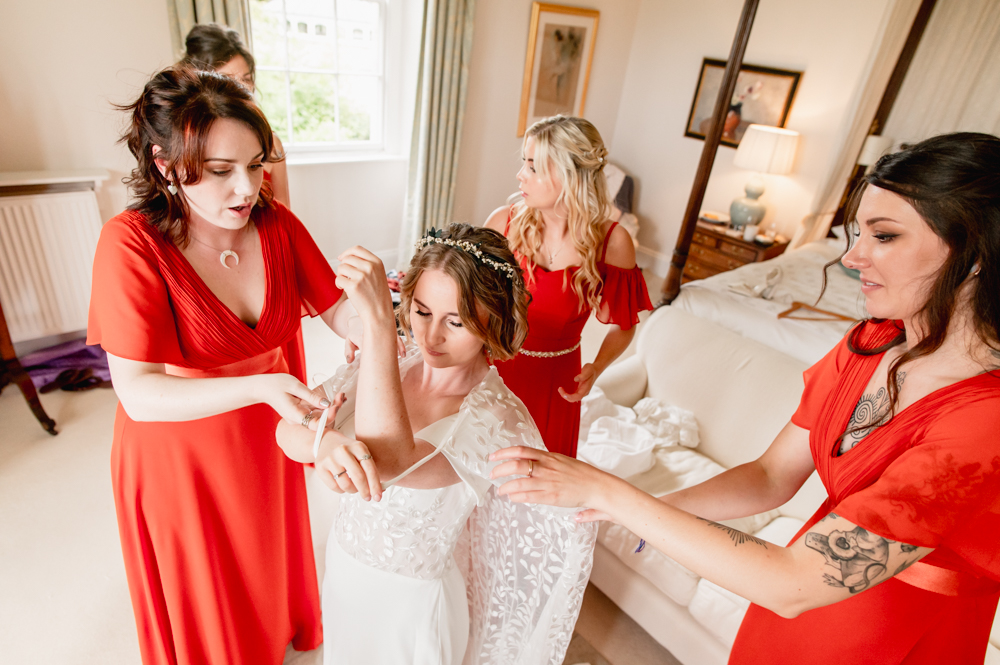 bride putting dress on matara