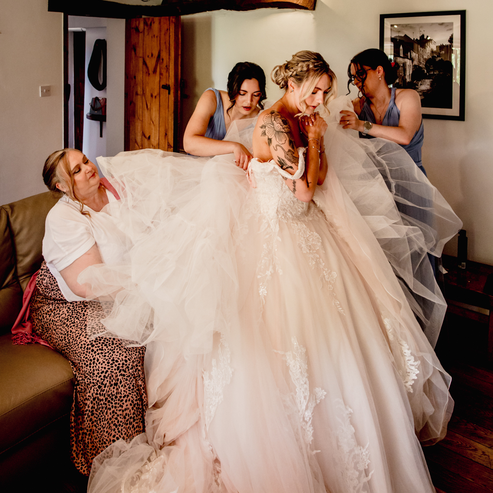 bride getting ready great tythe barn cotswolds