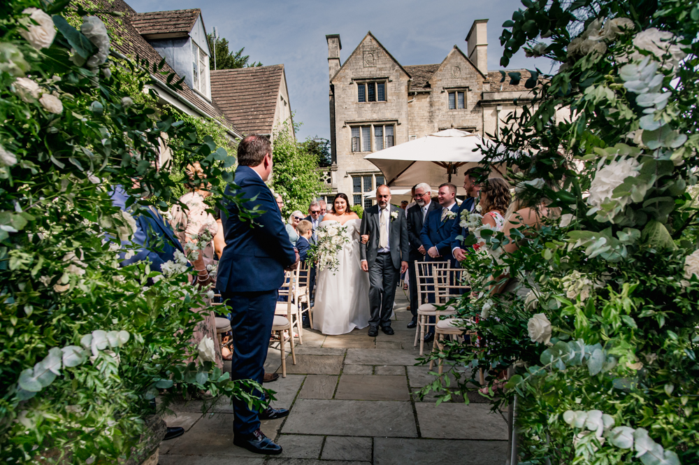 bride walking down aisle natural wedding photography
