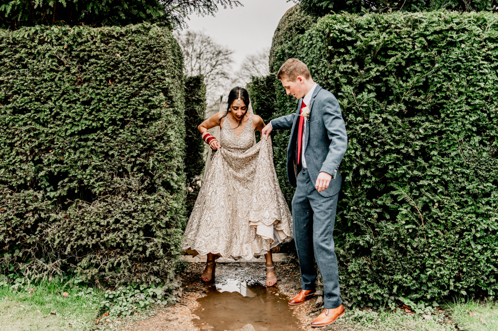 bride rain puddle fun documentary wedding photographer