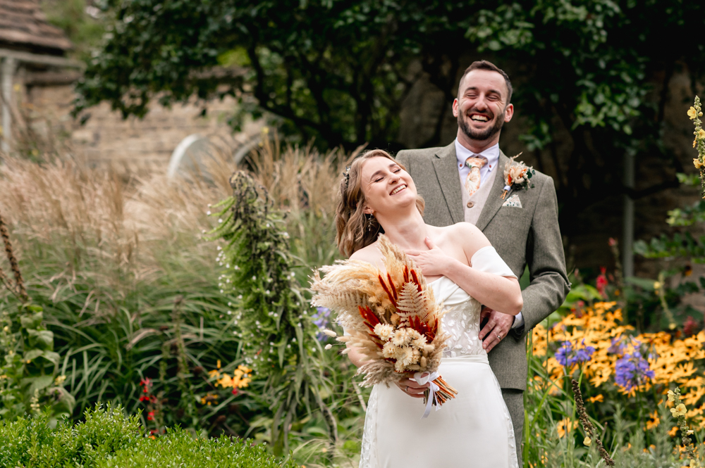 bride and groom laughing  matara centre cotswolds