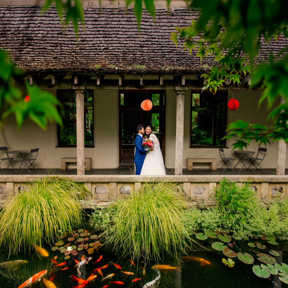 bride and groom koi capr pond cotswolds