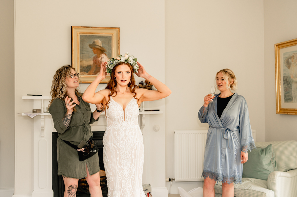 bride putting flower crown