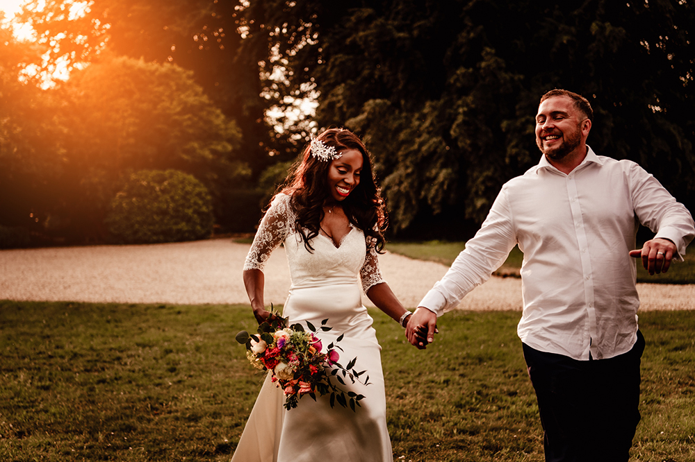 wedding couple running sunset