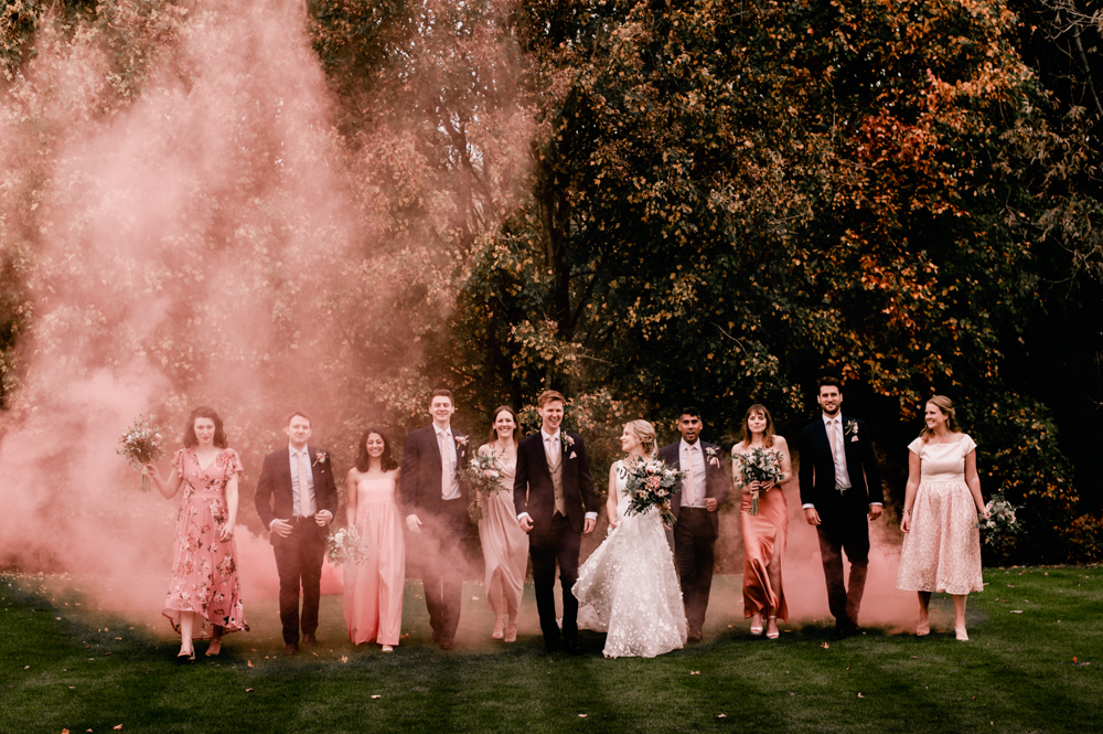 colourful pink smoke bomb grenade