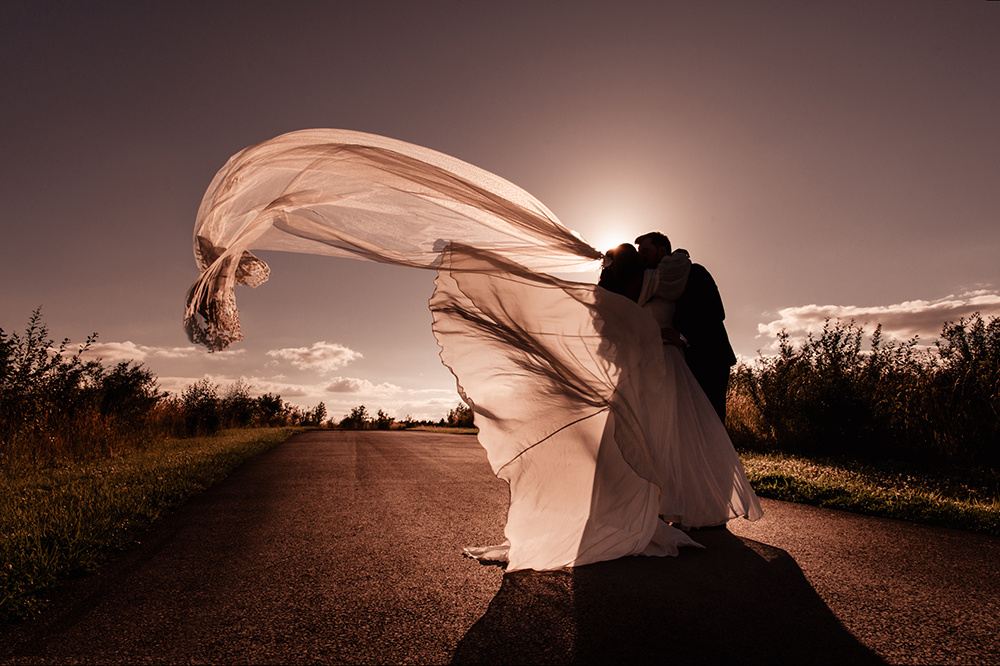 sunset wedding veil flying