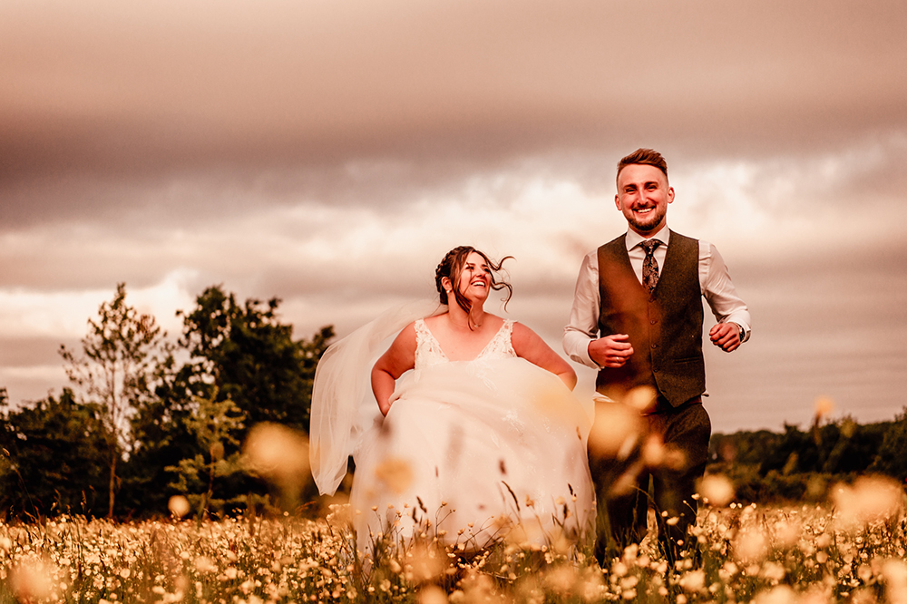 bride running meadow