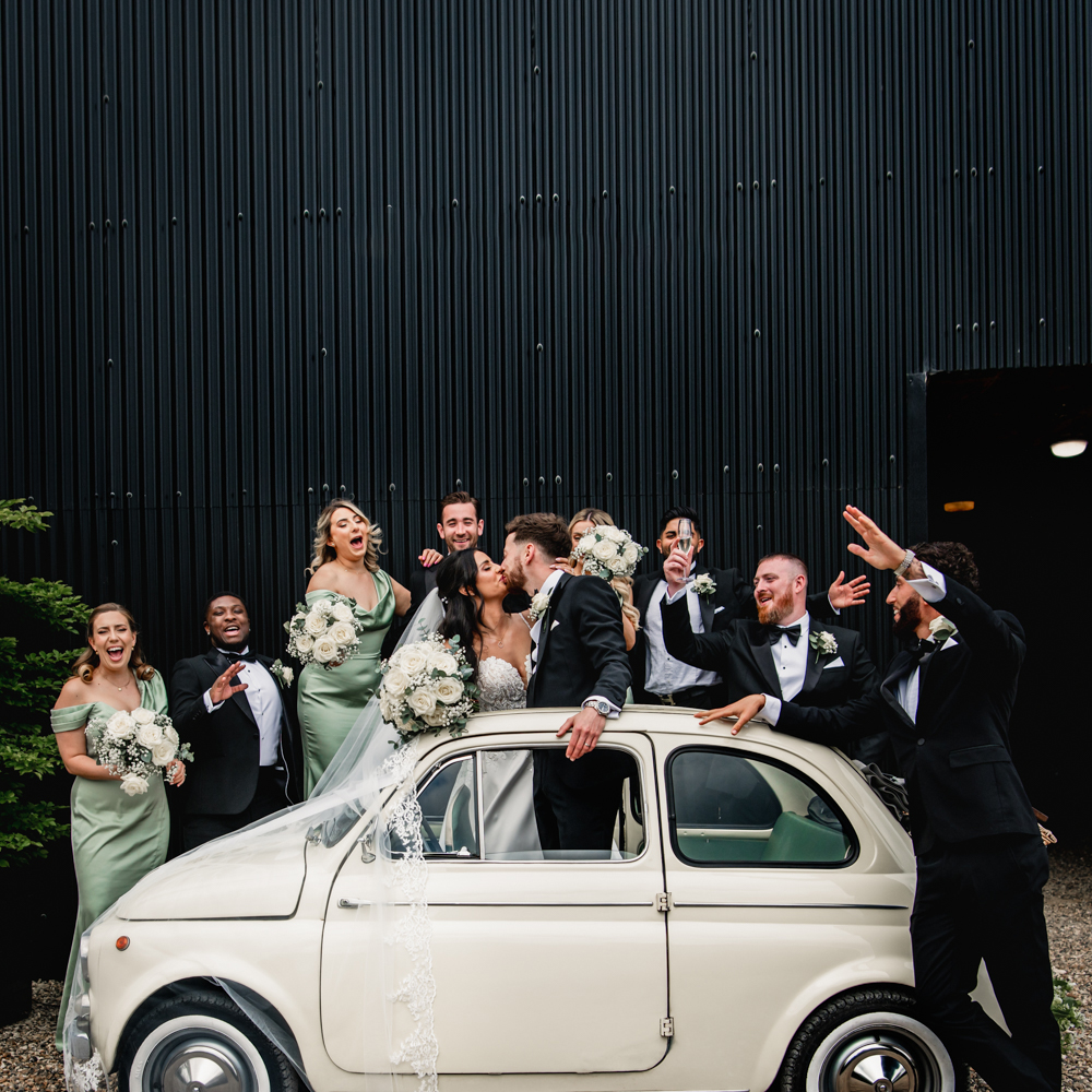 fun bridesmaids and groomsmen kissing photos
