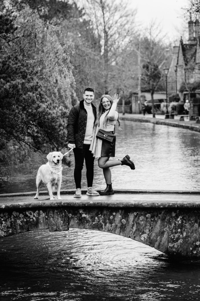 engaged couple on a bridge