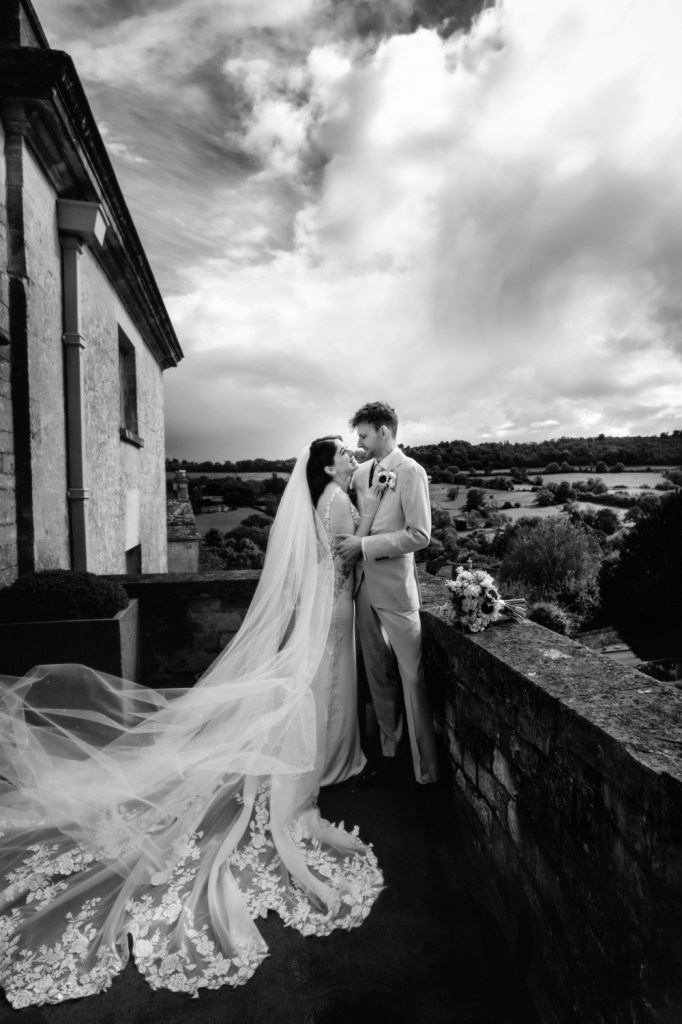 wedding couple on balcony countryside views