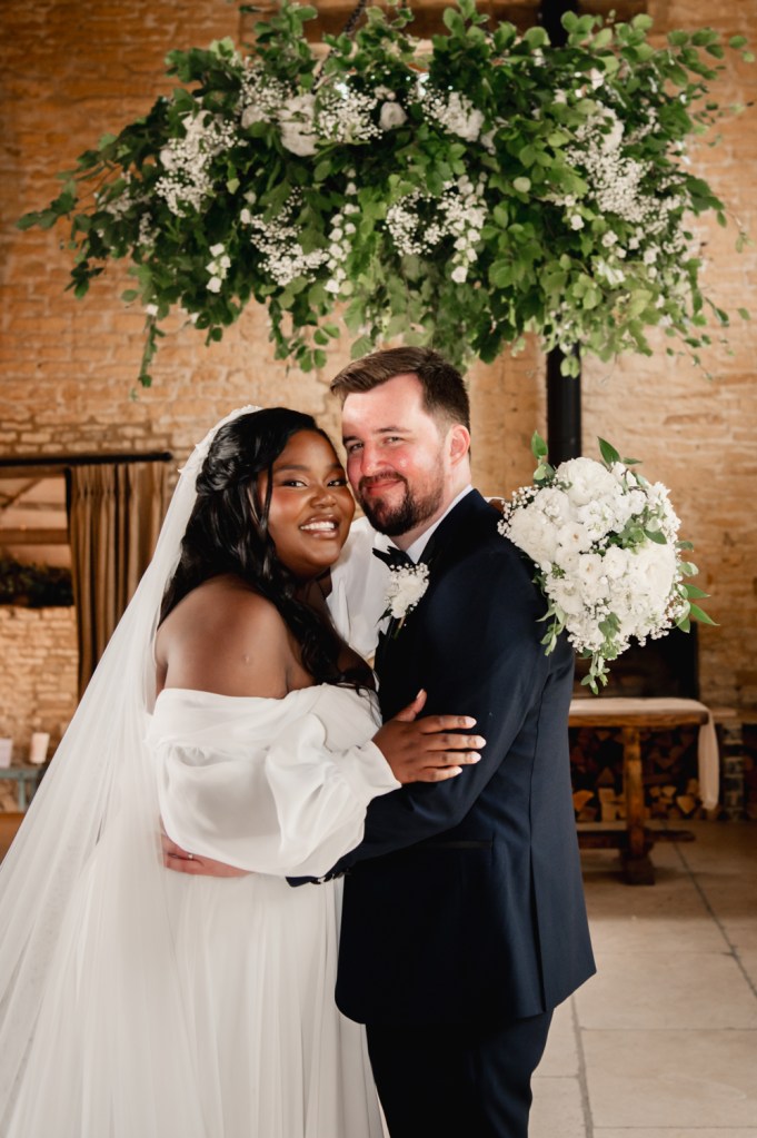 bride and groom  warm barn