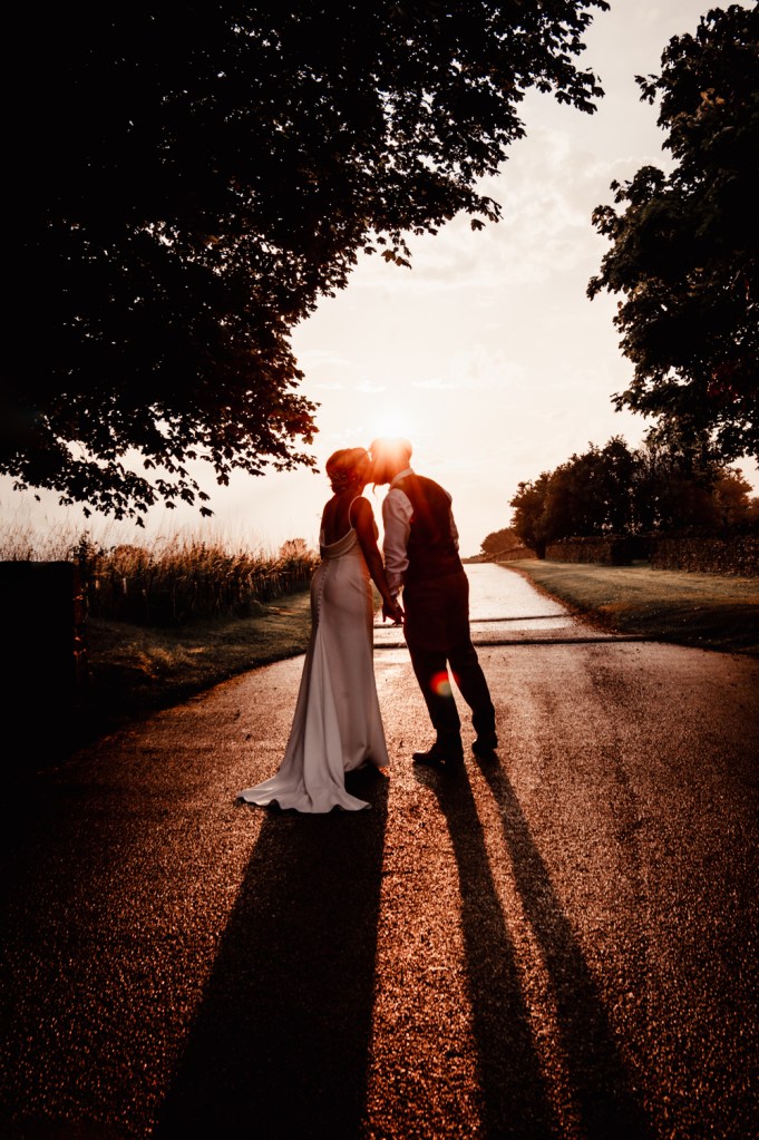 dramatic sunset wedding photos 