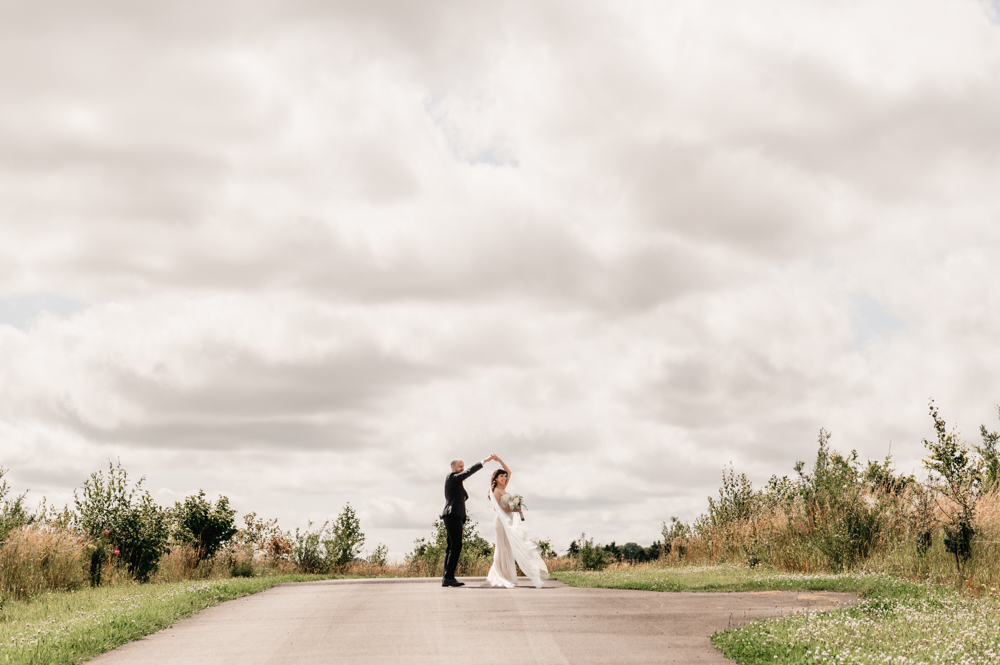 dramatic grey sky  bride and groom 