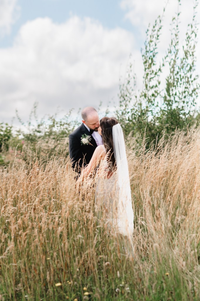 romantic kiss in a summer meadow