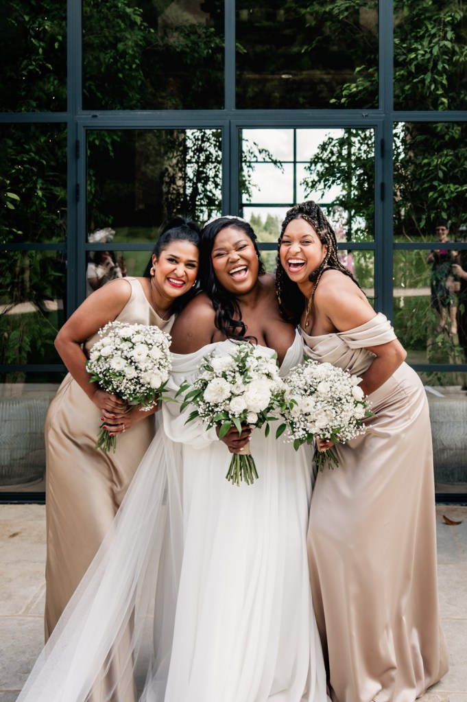 bride and bridesmaids laughing
