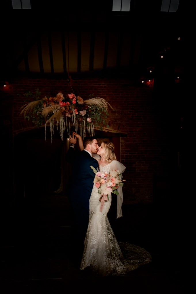 bride groom kissing milton end barn  wedding 