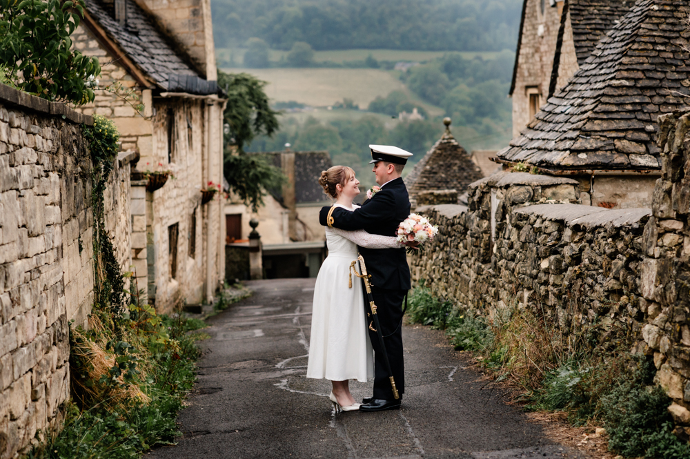 bride and groom cotswold stone wall