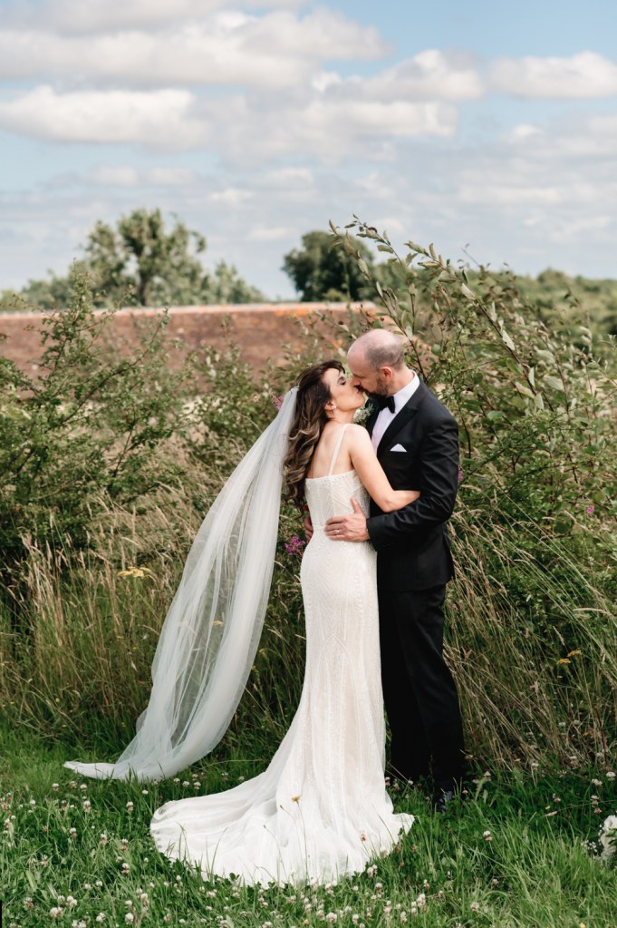 bride and groom kiss old gore barn